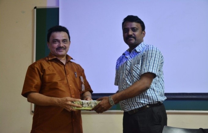 Prof. Manjunath felicitating Prof. Chidambara Kalamanji